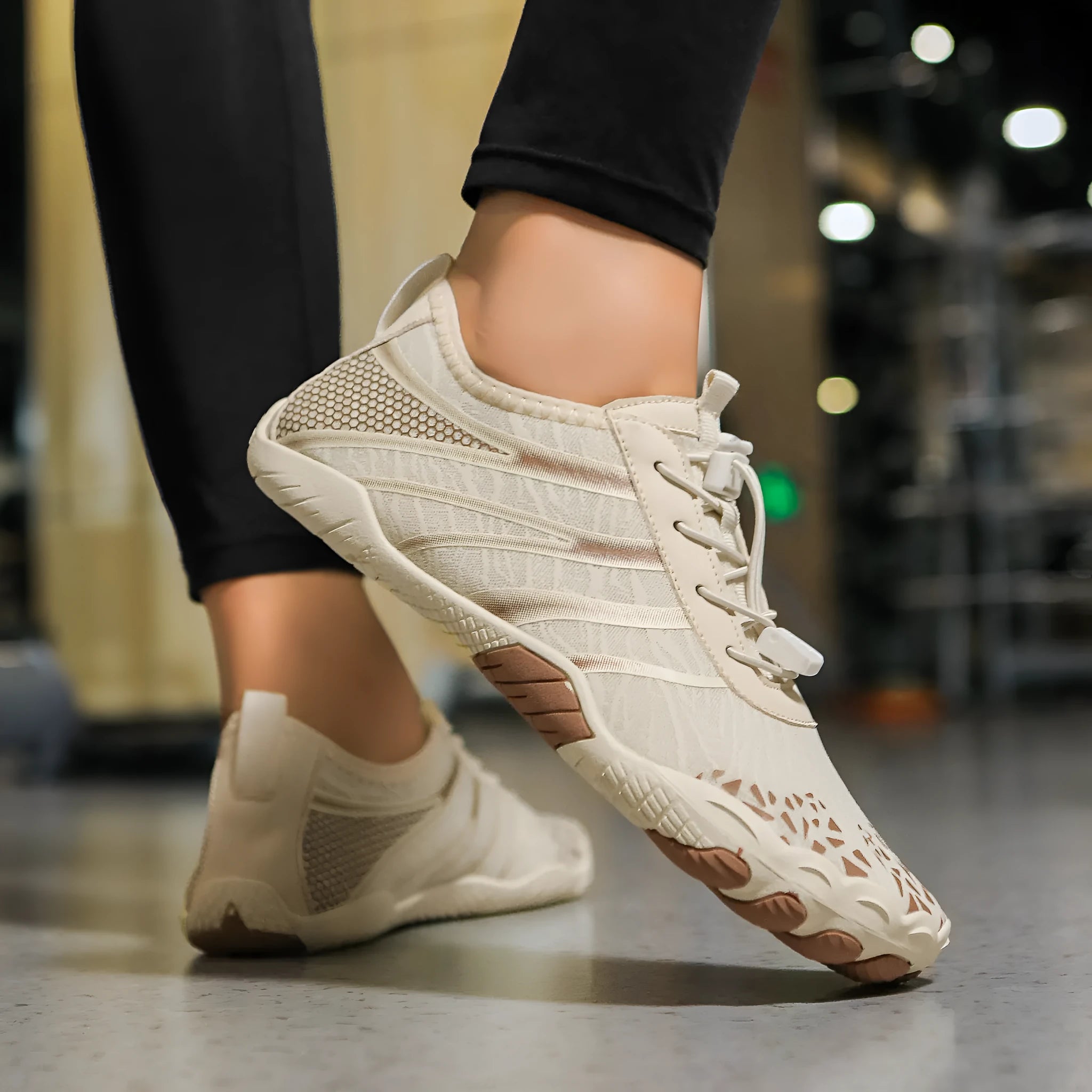 Beach running shoes with Lycra stretch fabric upper shown in multiple colours including beige and white pink.