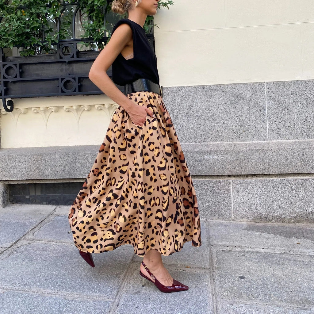 Brown leopard print women's long A-line skirt on a hanger.