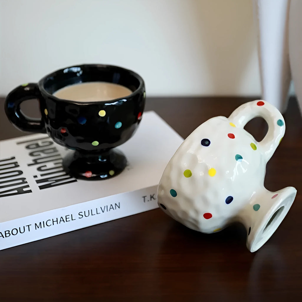 Hand-pinched ceramic mug with irregular shape and solid-colour finish, approximately 14.5cm tall