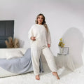 Women's milky white polyester two-piece pants set with crew neck top and matching trousers