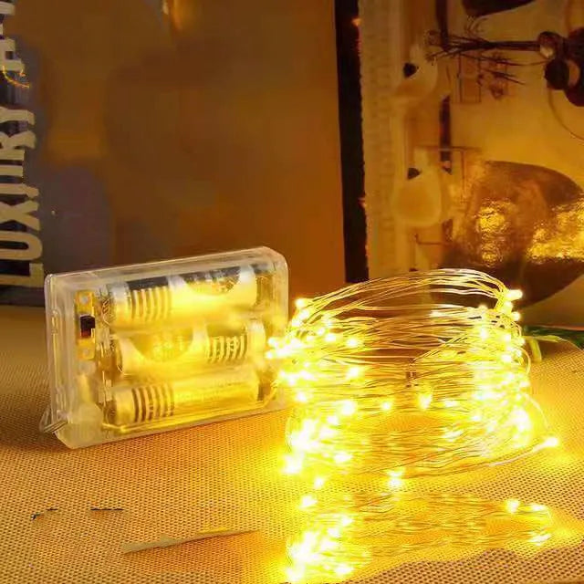 12-metre long copper wire LED string lights with 120 bulbs, shown in one of nine available colours.