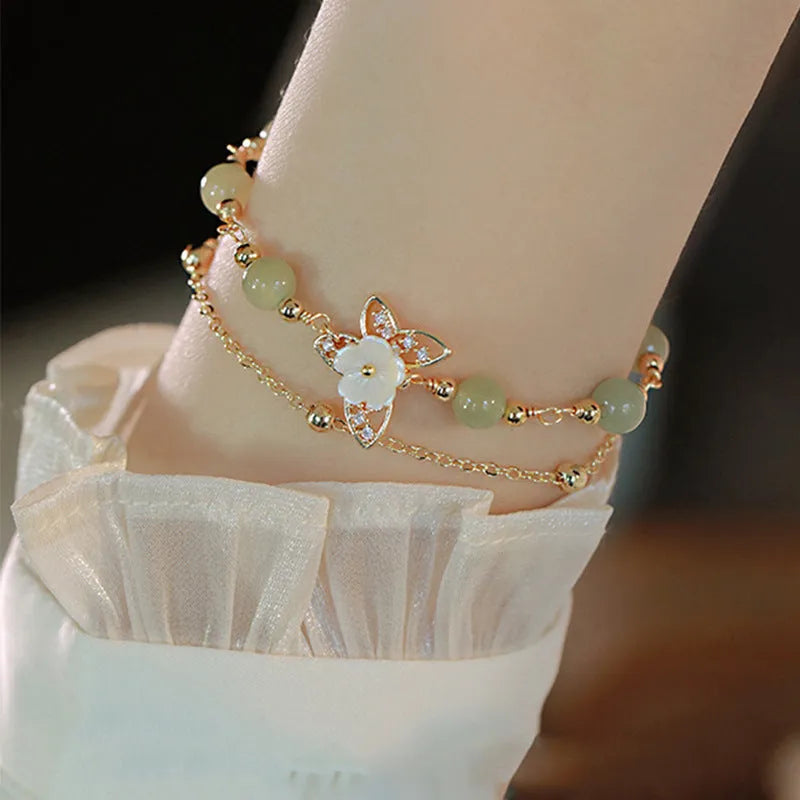 Women's copper butterfly bracelet with electroplated yellow gold finish and geometric design