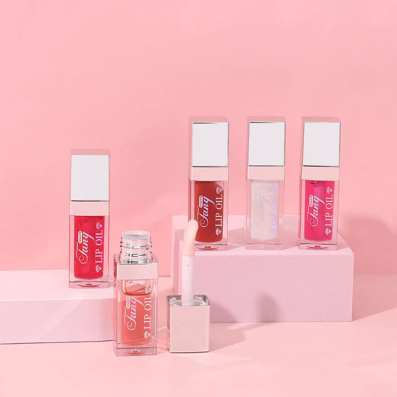 Mint lipstick set with five colour shades and a lip essence oil bottle.