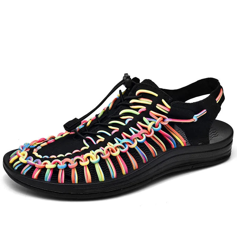 Woven Roman-style sandals with an elastic drawstring tie and non-slip rubber sole in rainbow colour.