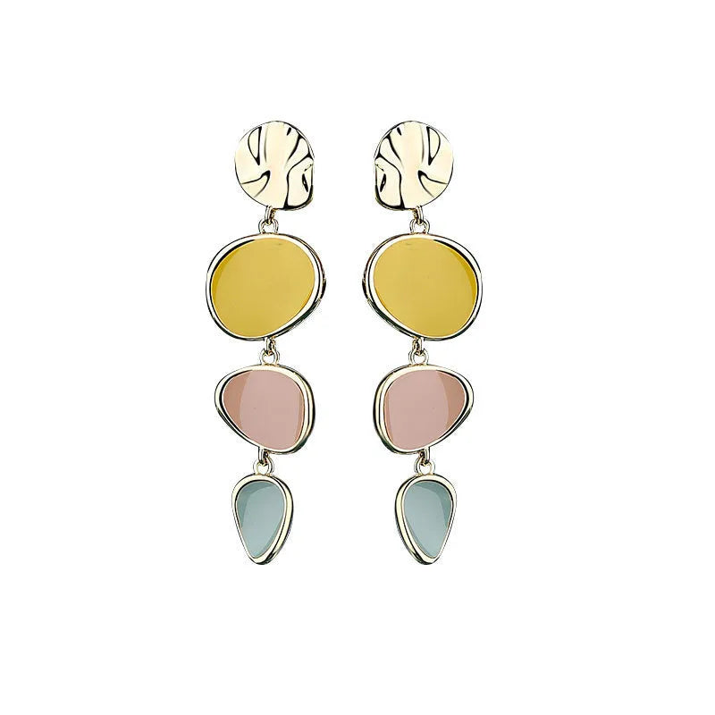 A pair of simple disc-shaped alloy earrings with a blended Morandi three-colour oil drip finish, showing a vintage wafer style.