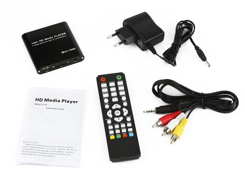 Compact black and blue all-metal 1080p HD media player with remote control on a wooden surface.