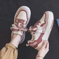 Beige and pink women's low-top rubber sneakers with a hidden height increase sole.