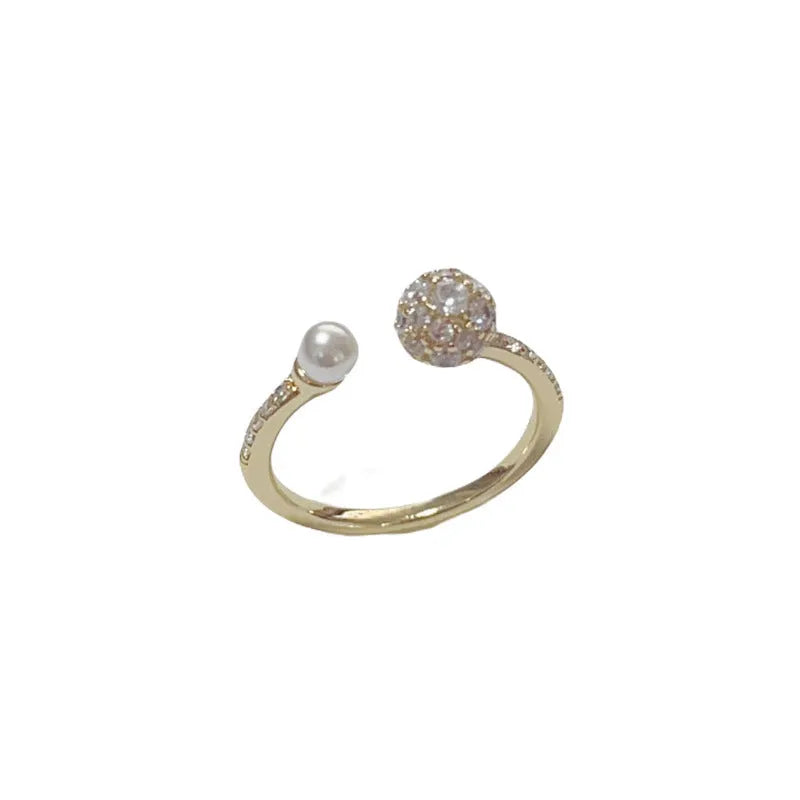 Open-end women's ring with round zircon and pearl elements in gold or silver real gold plating