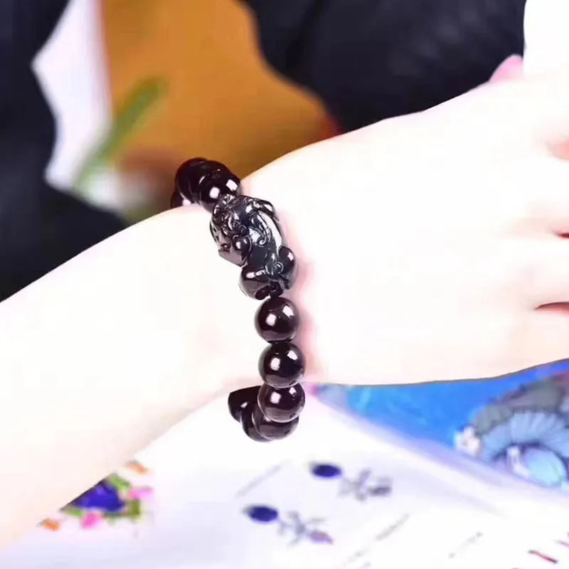Natural ice colour eye obsidian crystal bracelet showing marbled patterning on beads