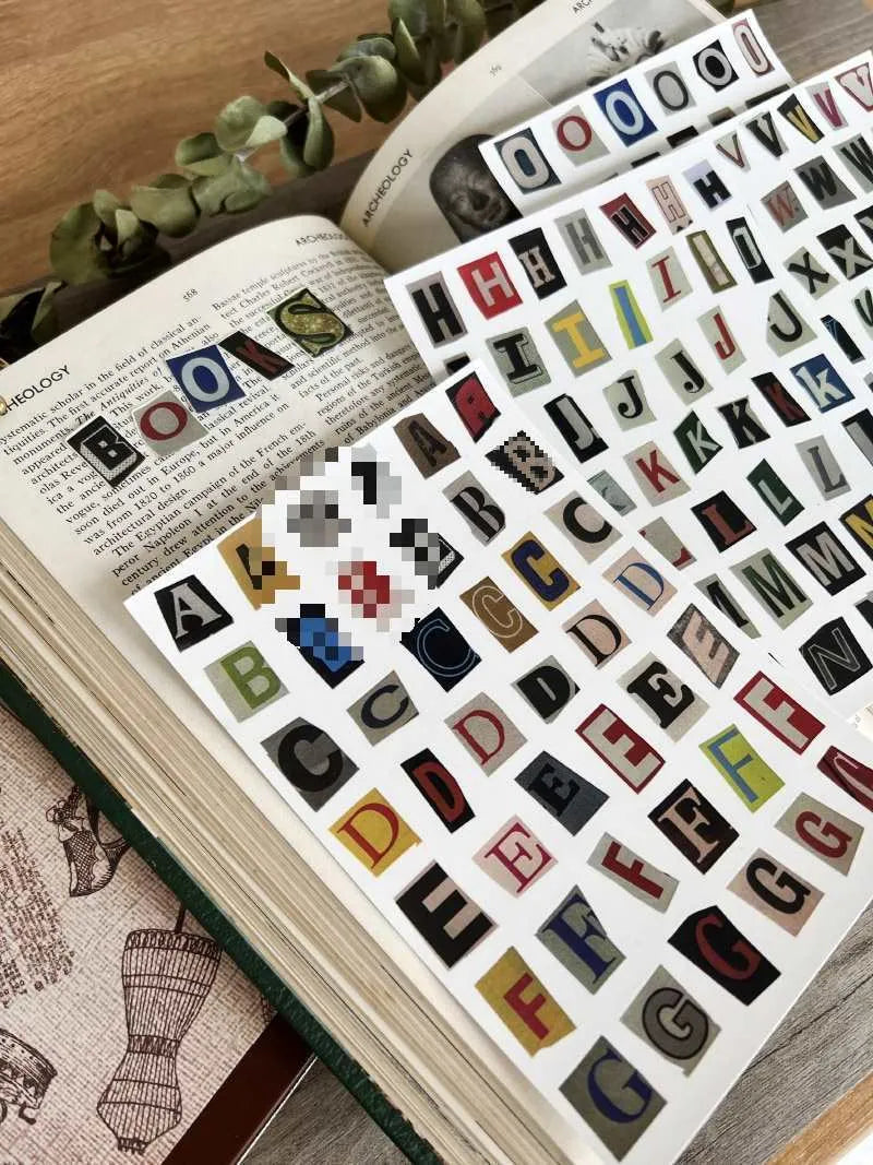 Set of cute style printed stickers featuring English letters, numbers, symbols, and weekday words for decoration and labelling.