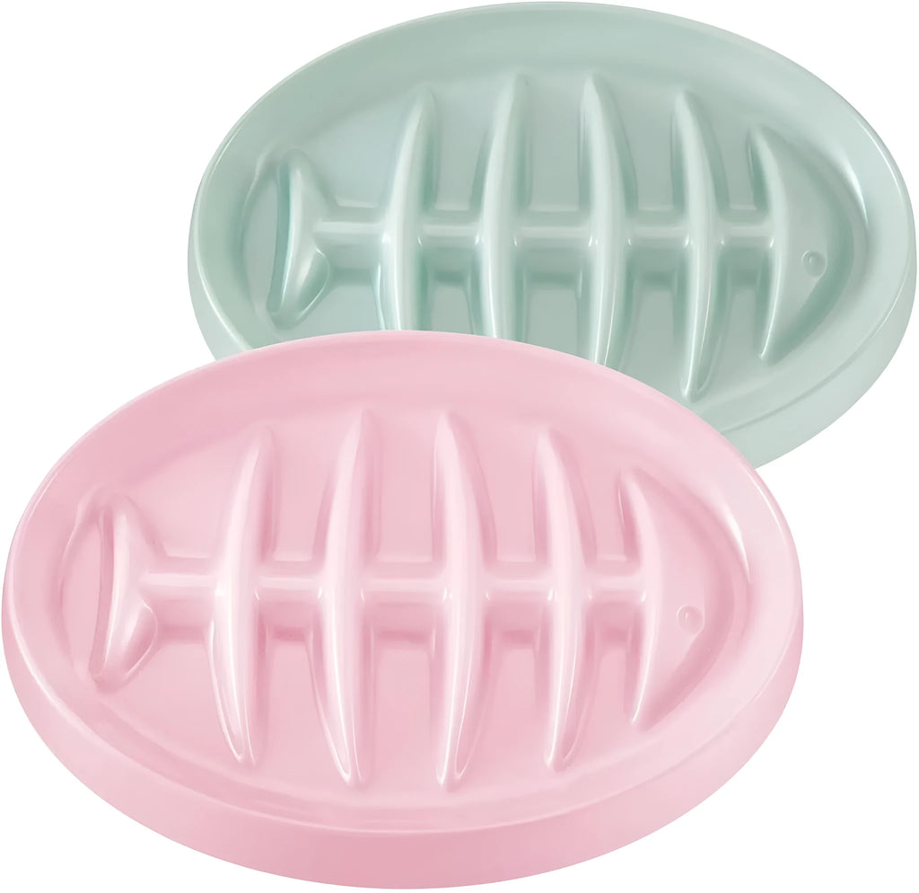 Green melamine fishbone slow feeder bowl for cats with raised ridges on a plain background