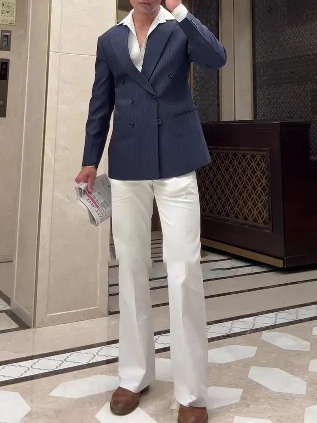 Man wearing a classic striped double breasted polyester blazer in a regular fit