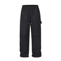 Black baggy paratrooper pants with an elastic drawstring waistband on a mannequin.