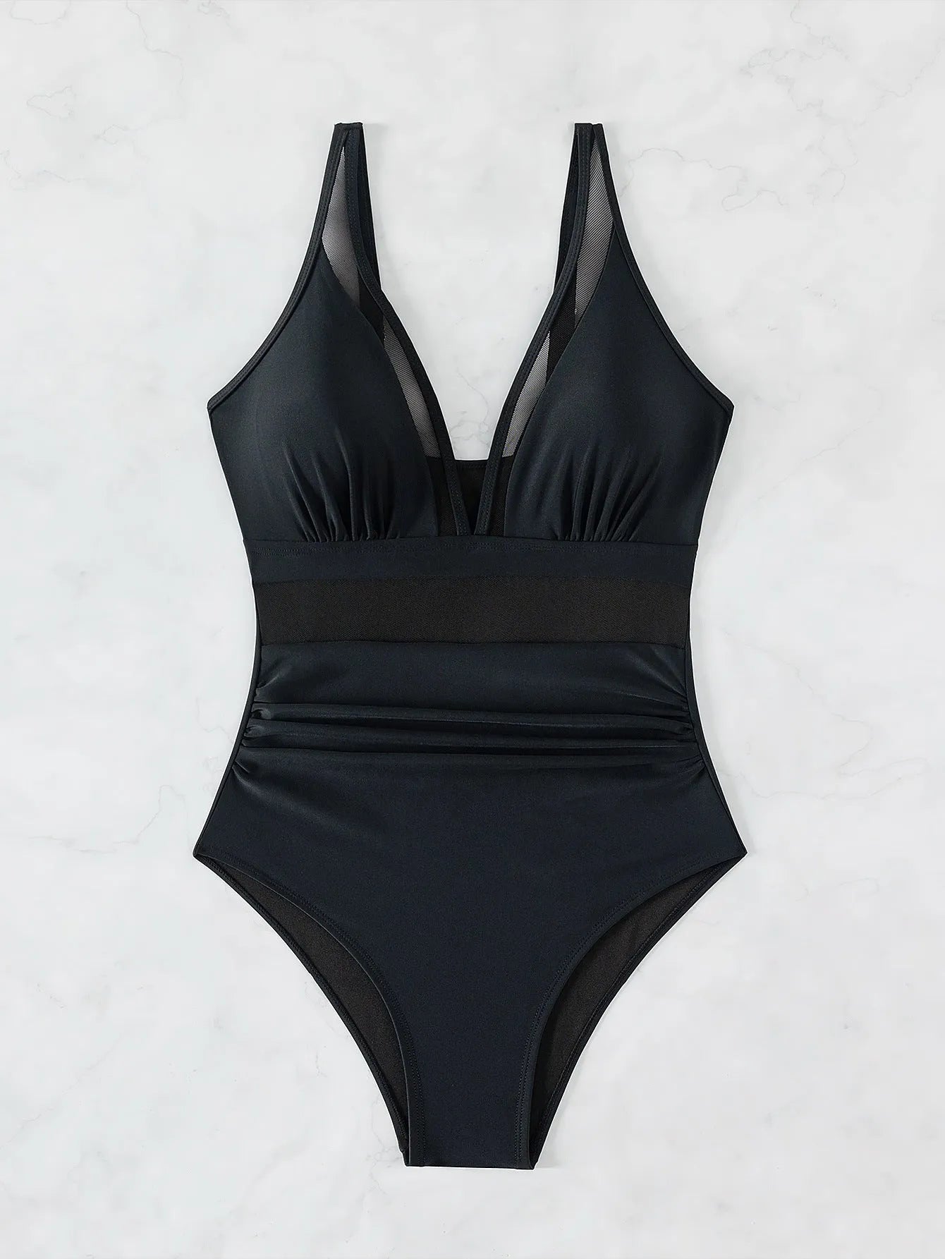 Black mesh halter bikini one-piece swimsuit on model showing sleeveless design and briefs style