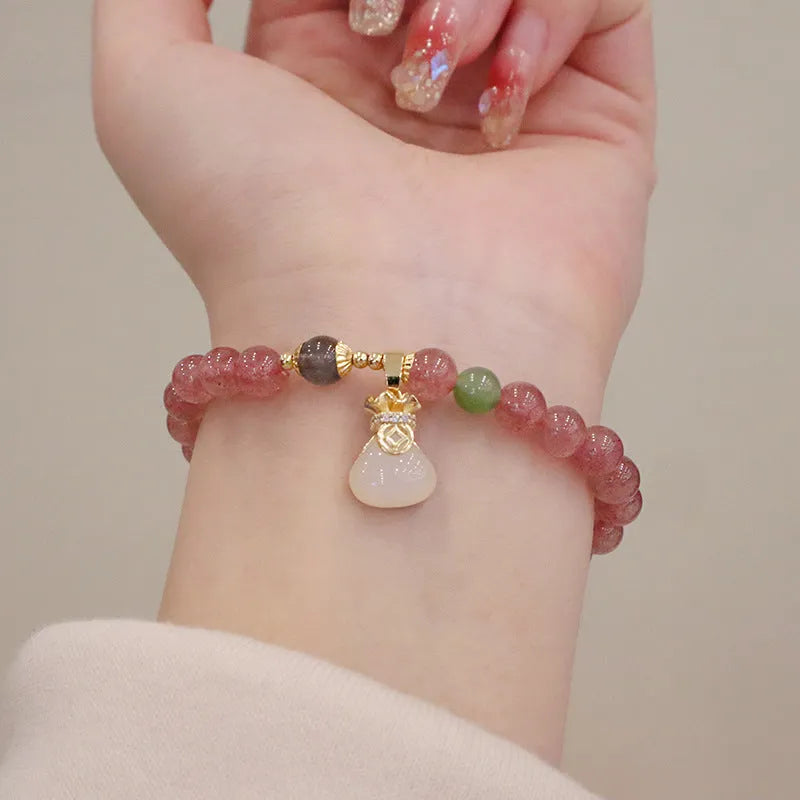Strawberry quartz women's bracelet with geometric stone pattern and purse charm pendant