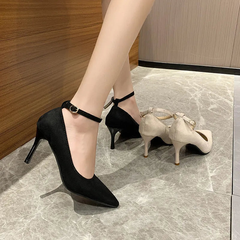 Women's black and white stiletto heel pump shoes with ankle buckle, showing 5cm and 8cm heel height options.