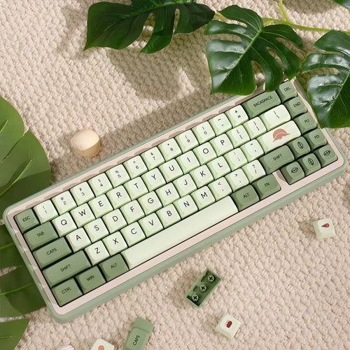 Full set of 124 matcha green PBT keycaps for a mechanical keyboard, showing various international layout options.