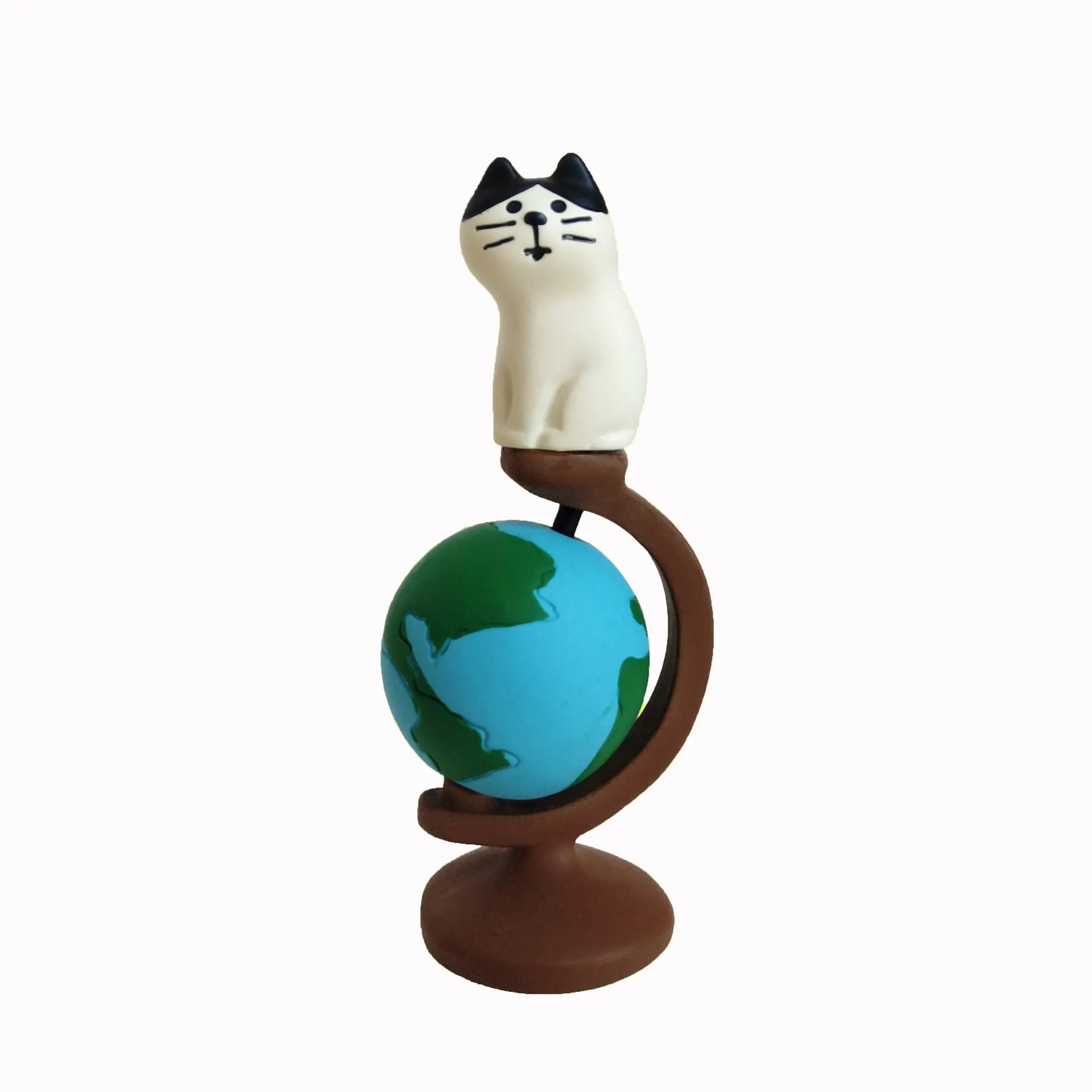 Cartoon style Statue of Liberty cat resin figurine craft on display surface.