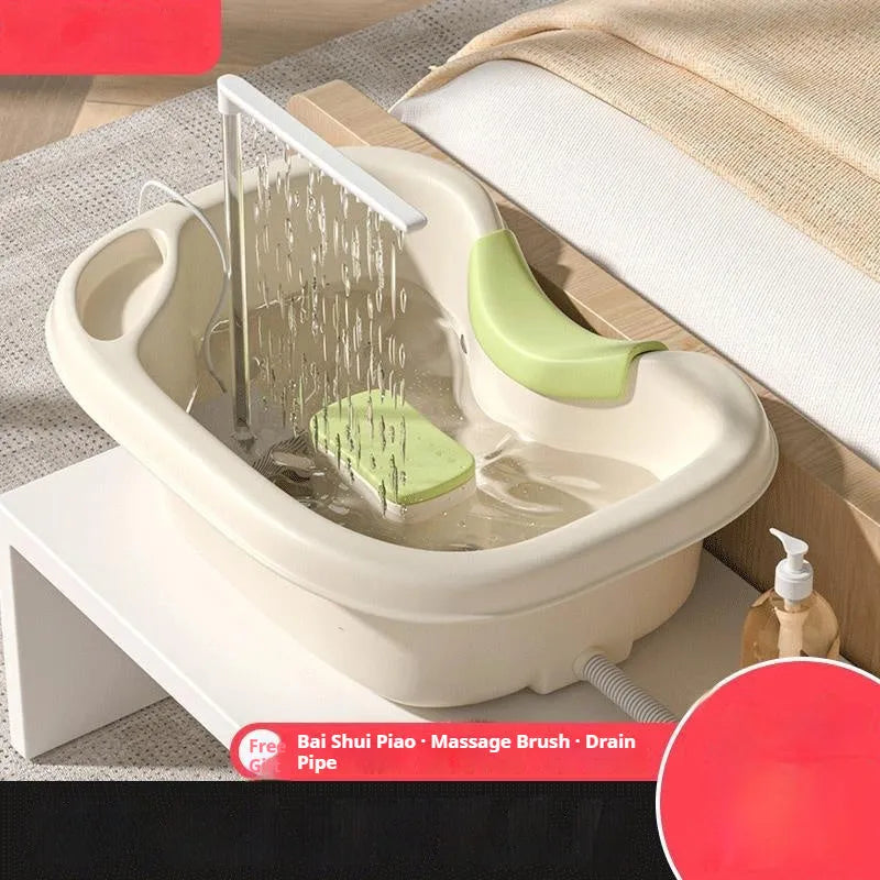 Portable plastic shampoo basin with circulating water pump and neck pillow for washing hair while lying in bed