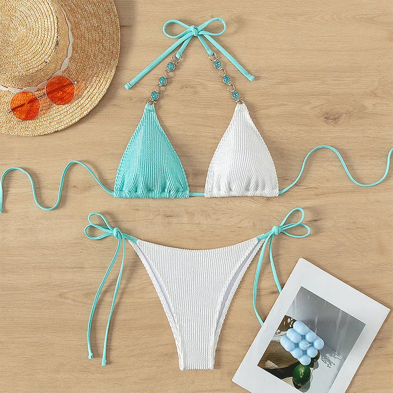 Women's colour-matching two-piece swimsuit with front lace-up detail and pearl chain decoration.