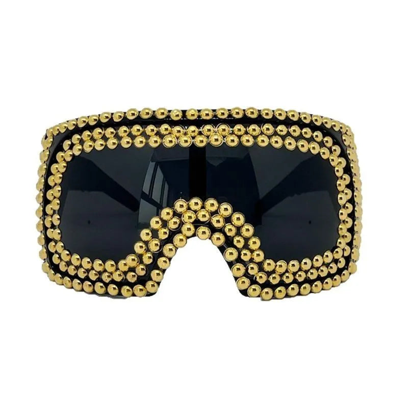 Men's square aviator sunglasses with large rim and rivet details in gold colour.