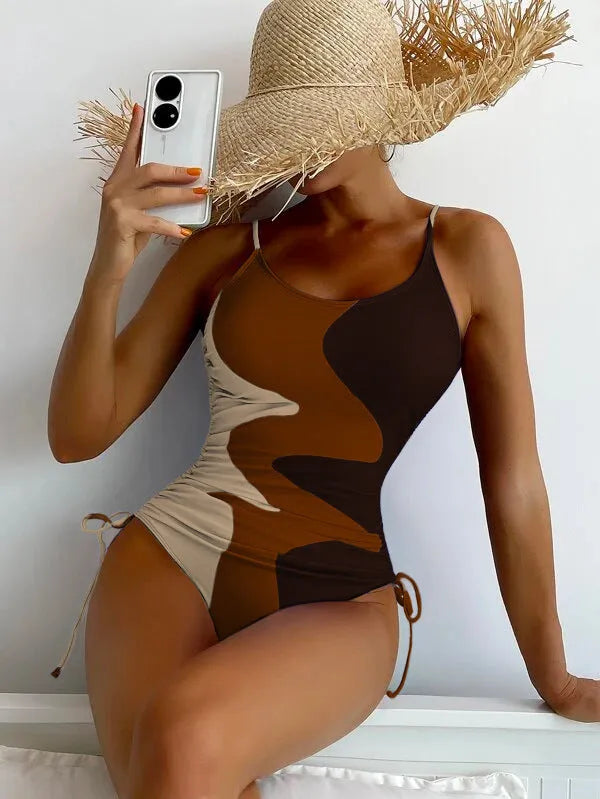 Women's sleeveless one-piece swimsuit in blue, purple, brown, or green colours with striped or solid patterns