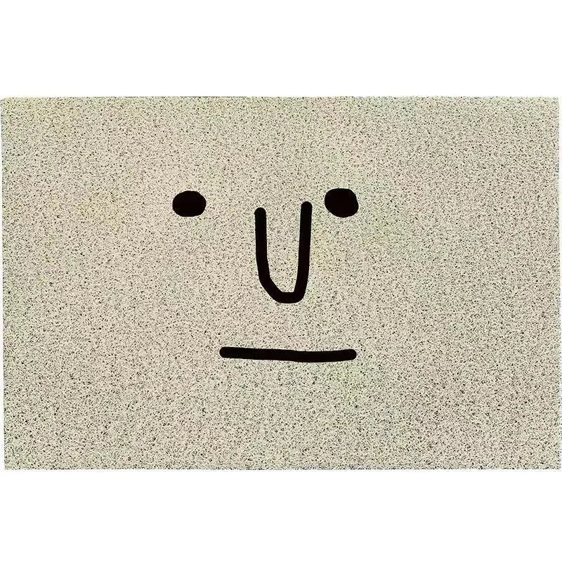 Square PVC floor mat with a cartoon facial expression geometric pattern in Mr. Big Nose colours.