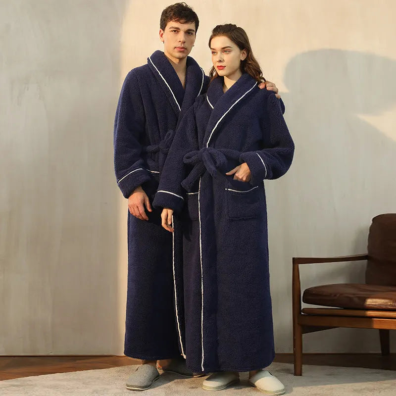 Man and woman wearing a matching thick flannel couple's bathrobe set in a winter colour.