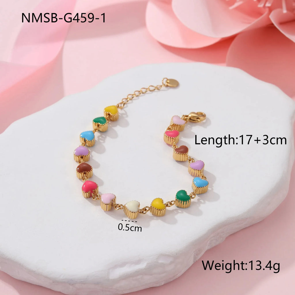 Gold plated women's bracelet with love heart pendant on titanium steel chain