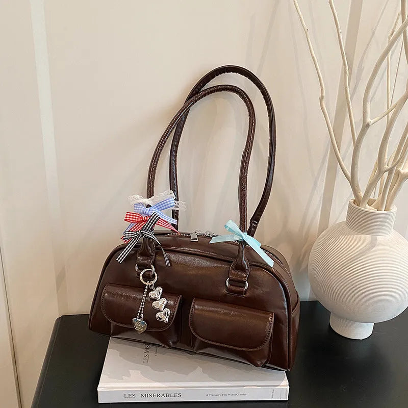 Women's retro PU leather pillow shoulder bag with flap closure in black colour