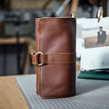 Handmade cow leather vintage wallet showing tape extraction closure and solid colour finish