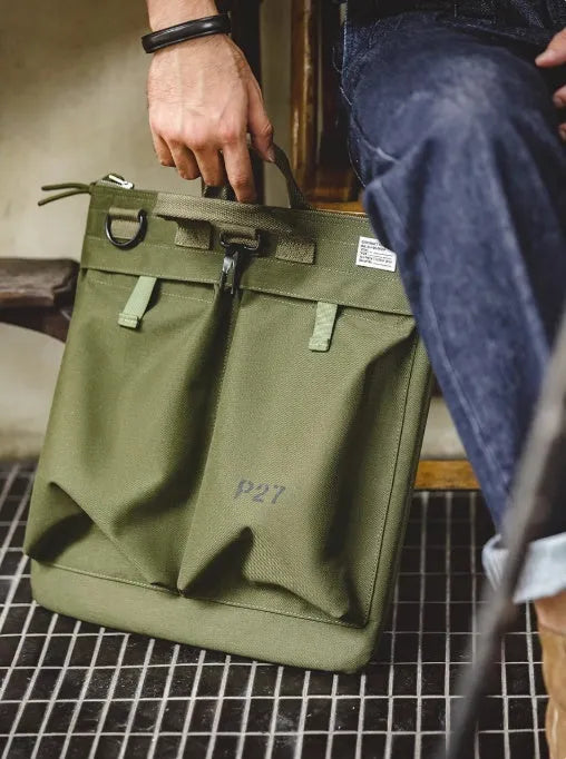 Canvas messenger crossbody bag in charcoal black with shoulder strap and hard handle