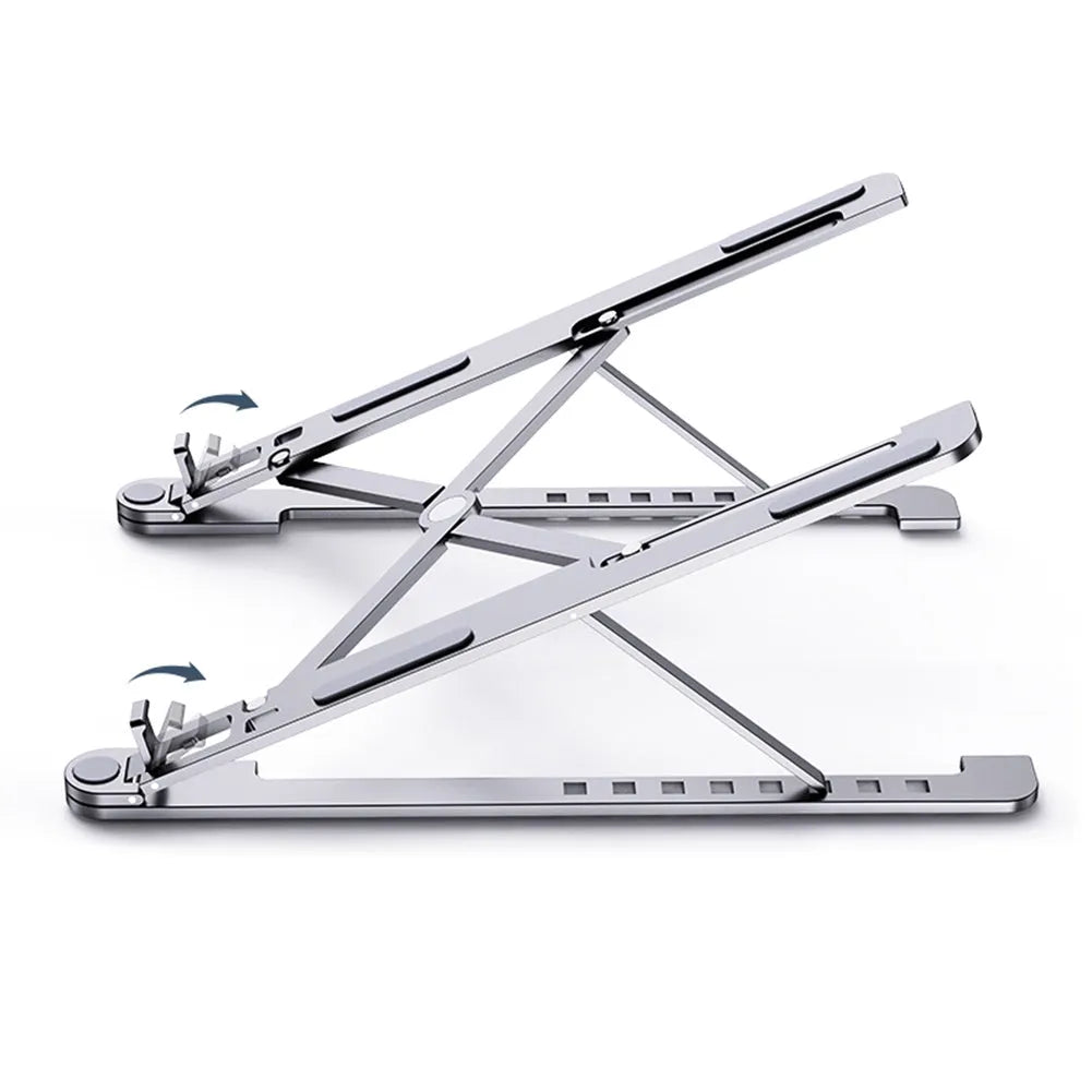 Silver foldable aluminium laptop stand holding a MacBook at an adjustable angle.