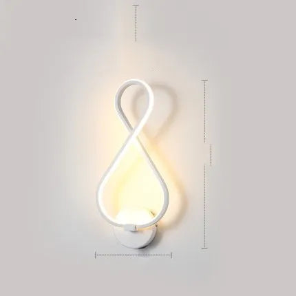 Nordic minimalist LED wall lamp with silicone shade in black finish mounted beside bed