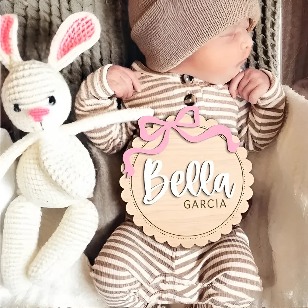 Square wooden baby room ornament with custom name text for wall decoration.