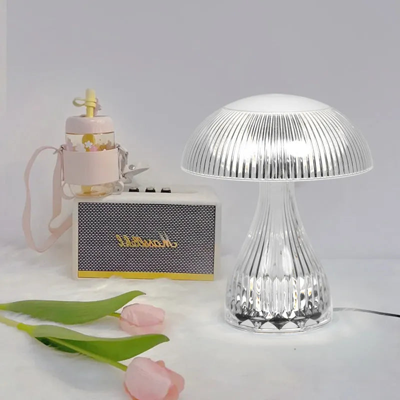 White rechargeable touch night lamp with USB charging cable showing three colour lighting options