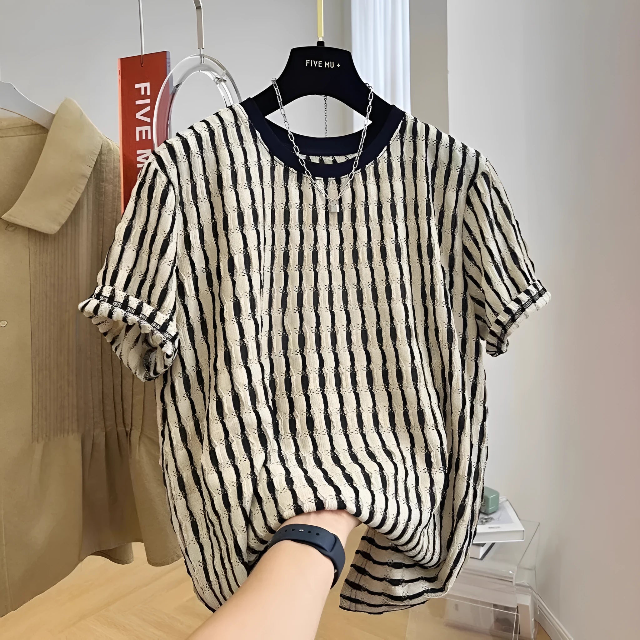 Black striped men's loose pullover shirt with short sleeves made from linen and silk blend fabric