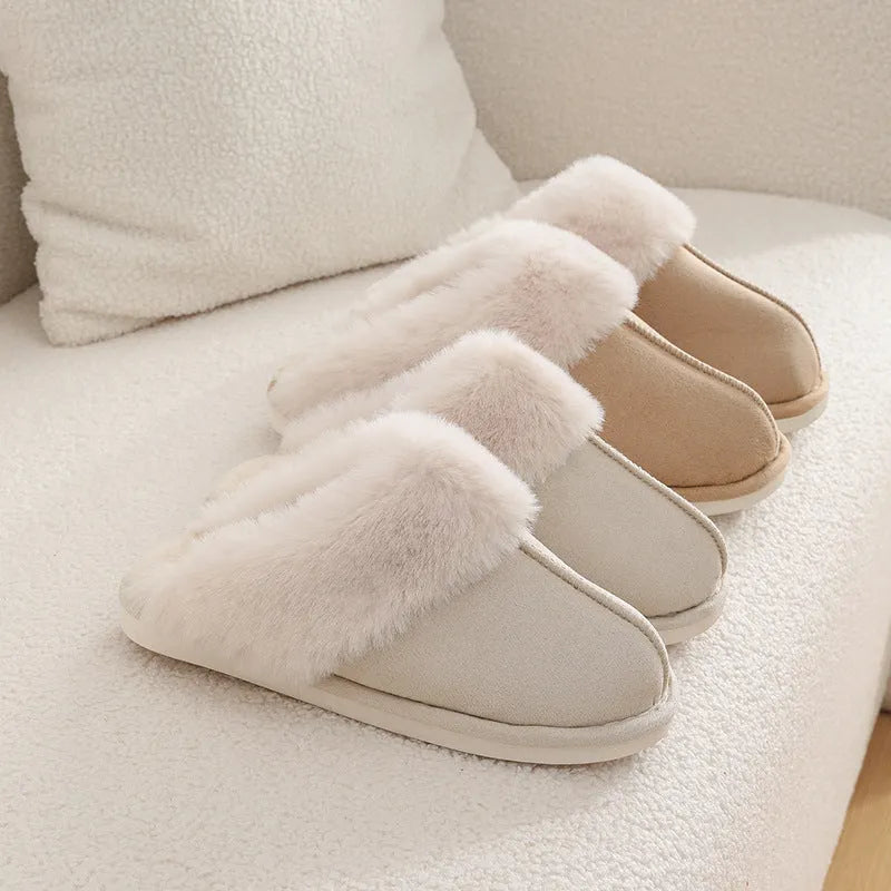 A pair of round-toe flat-heel plush slippers with stitching detail, shown in one of five available colours.