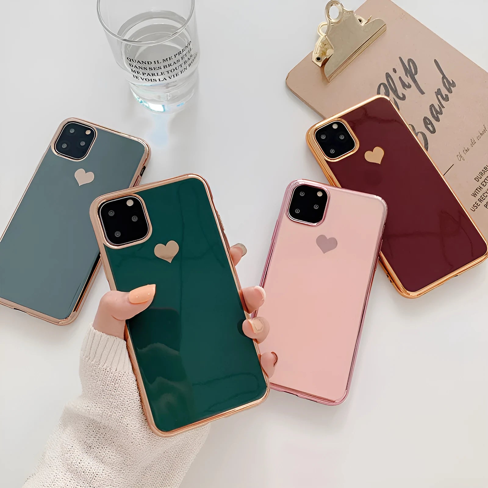 Slim solid colour TPU back cover case for iPhone on a table.