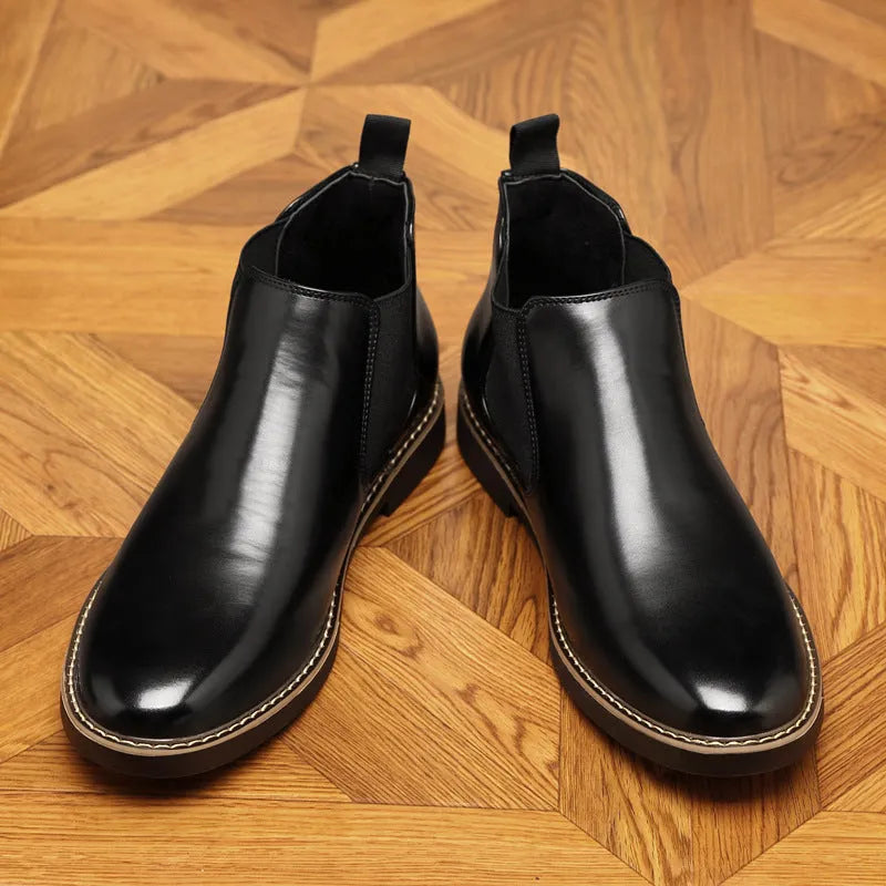 Men's formal black leather pointed-toe boots with a square heel on a white background