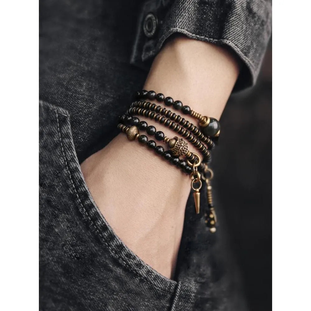 Geometric black beaded multi layered bracelet with natural styling elements