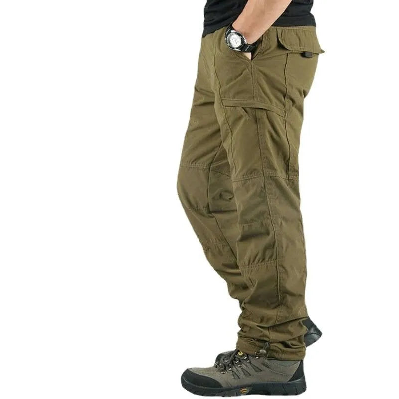 Man wearing thickened warm windproof waterproof fleece lined cotton trousers in army green with belt and double-layer waistband
