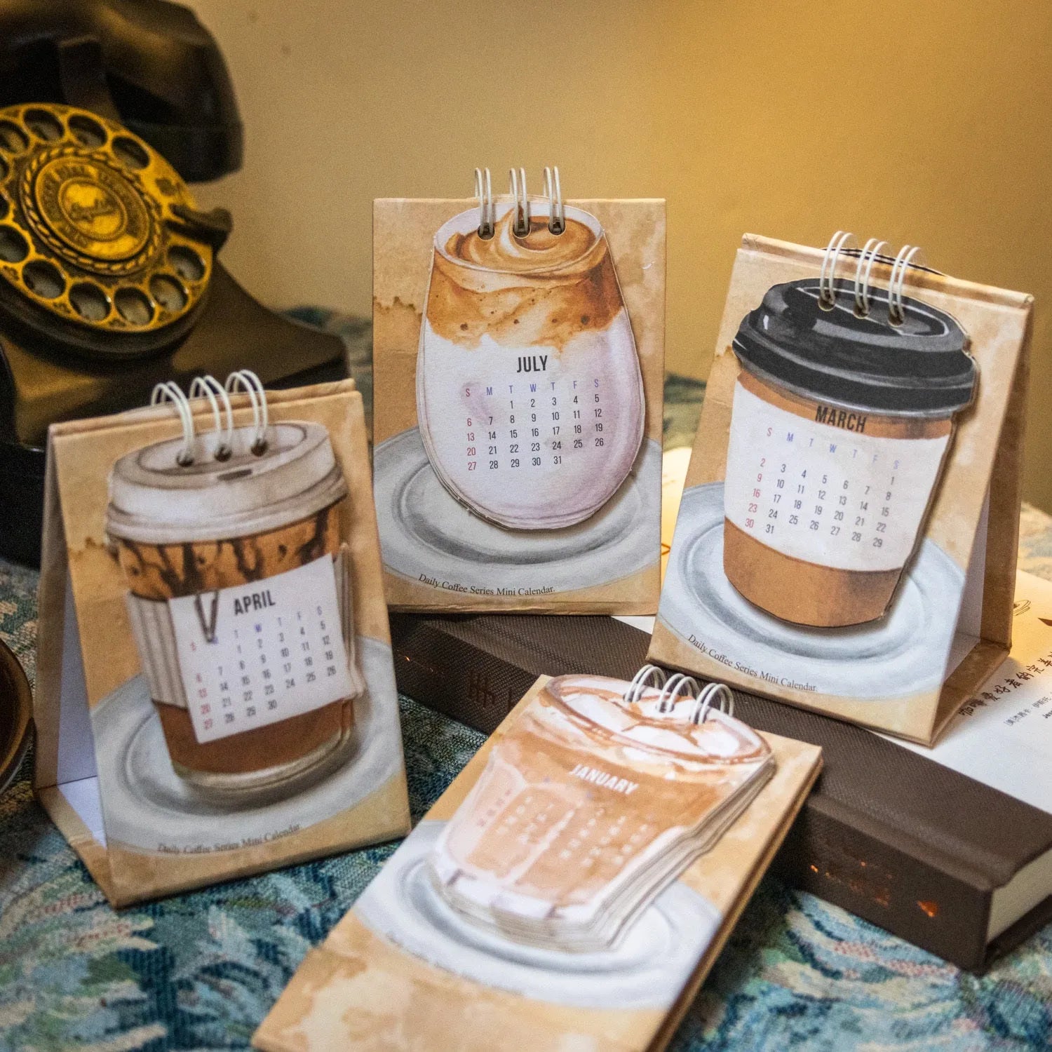 Coffee mini desk calendar 2025 set showing four different themed designs