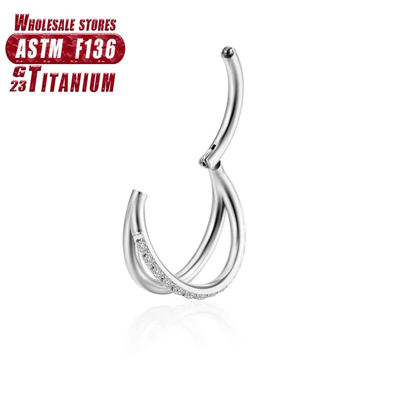Titanium alloy nose ring jewellery on a plain background showing silver and gold colour options.
