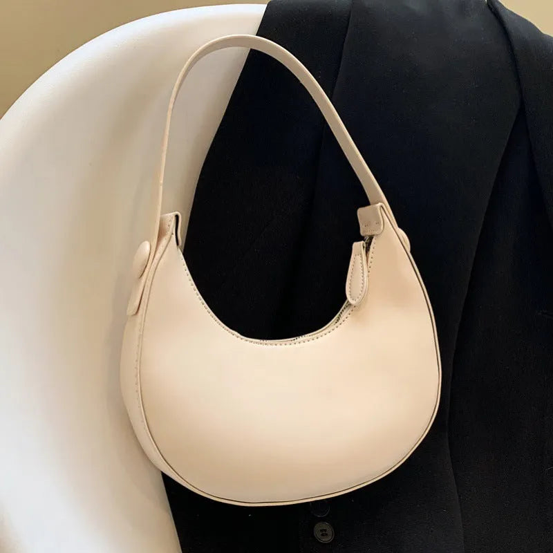 Women's retro dumpling-shaped PU shoulder bag in cream yellow with sandwich pocket
