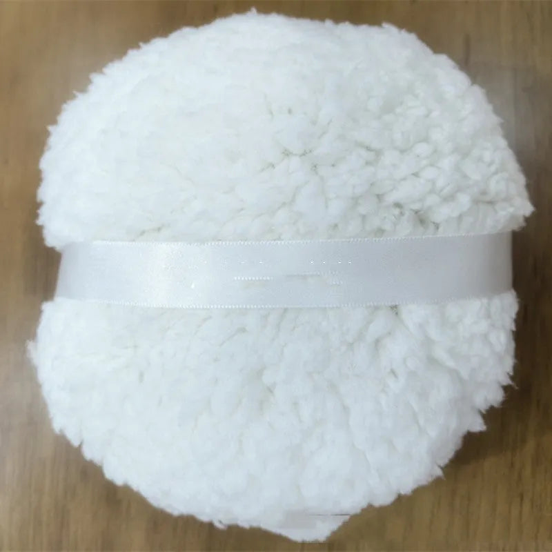 Oversized rectangular plush powder puff for face makeup on a white background.