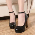 Women's chunky heel high heels in black and white, showing round toe and mid-height heel.
