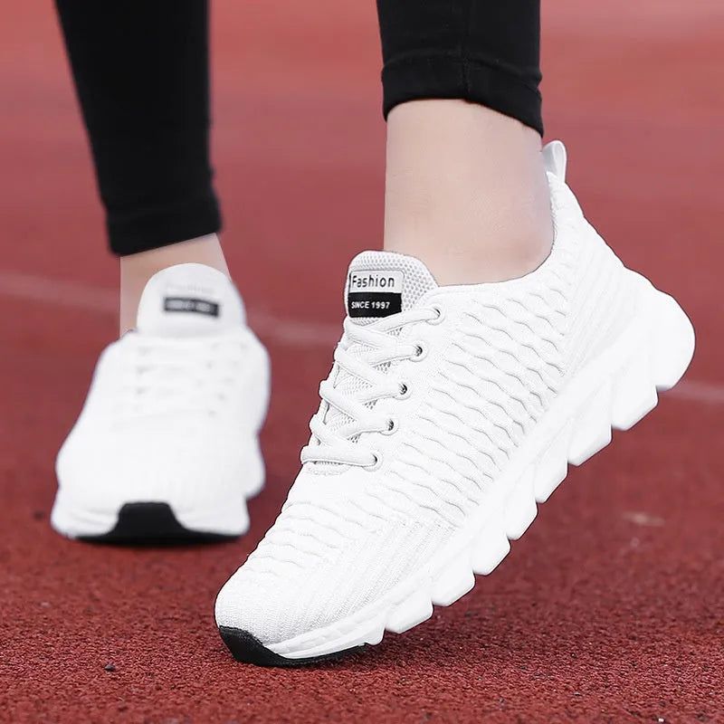Women's running shoes in black, pink, or white with fly weaving upper and wear-resistant outsole