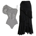 Women's black and white striped one-piece swimsuit with a ruffled skirt.