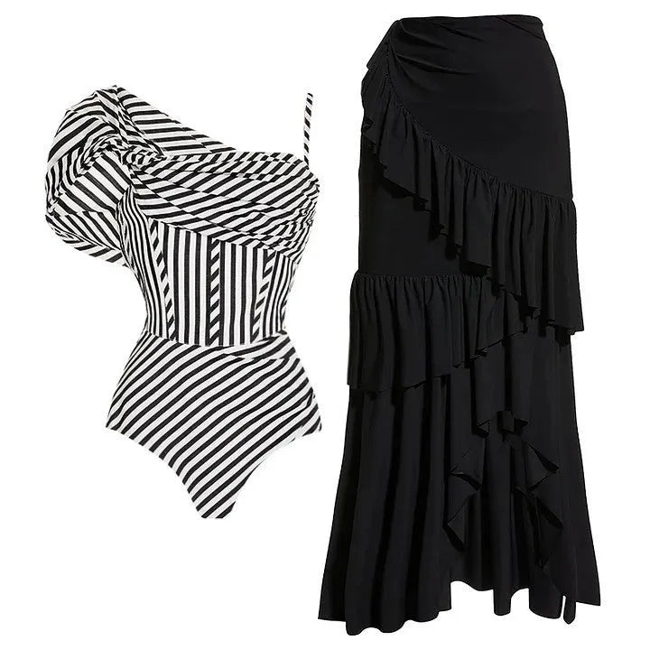 Women's black and white striped one-piece swimsuit with a ruffled skirt.